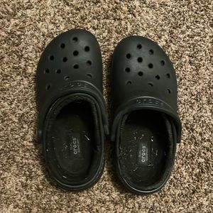 I am selling black crocs they have a little bit of grass in them.